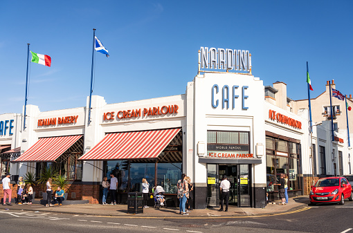 Largs, Scotland - People outside the art deco exterior of Nardini Cafe in Largs, especially popular for their ice cream.