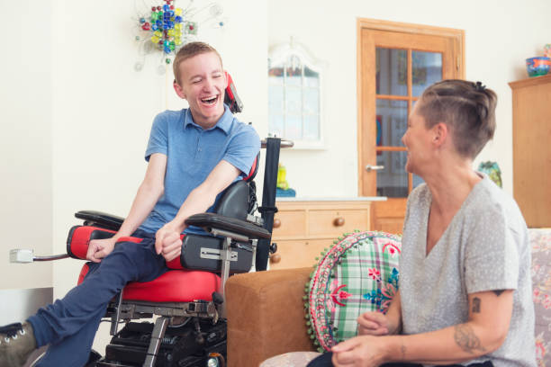 istock Happy young ALS patient with his mom 1297447298