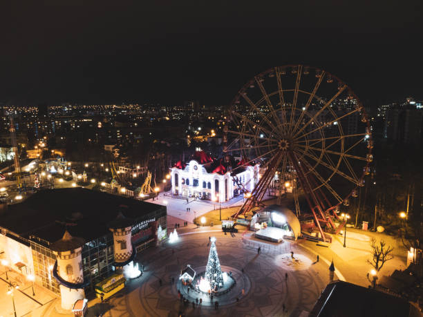 istock Ferris wheel not working in Kharkiv city at night 1297448725