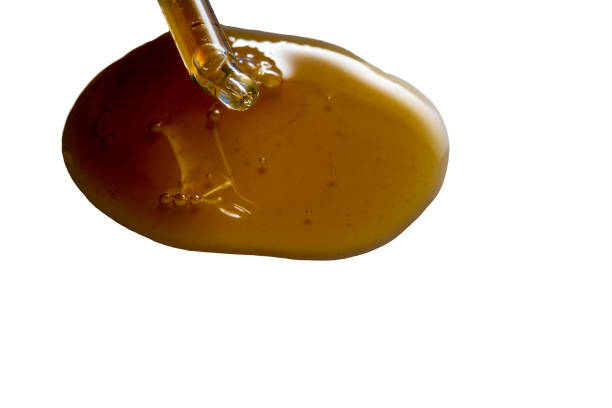 istock Take a pipette naphthalene black cosmetics shampoo from oil. Isolate on a white background 1297448728