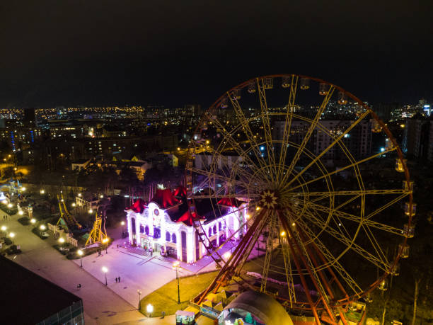istock Ferris wheel not working in Kharkiv city at night 1297448808