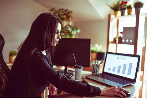 istock Female In Dark Clothing Evaluating Her New Business Project 1297448835