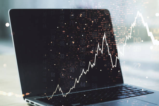istock Double exposure of abstract creative financial chart with world map on laptop background, research and strategy concept 1297448886