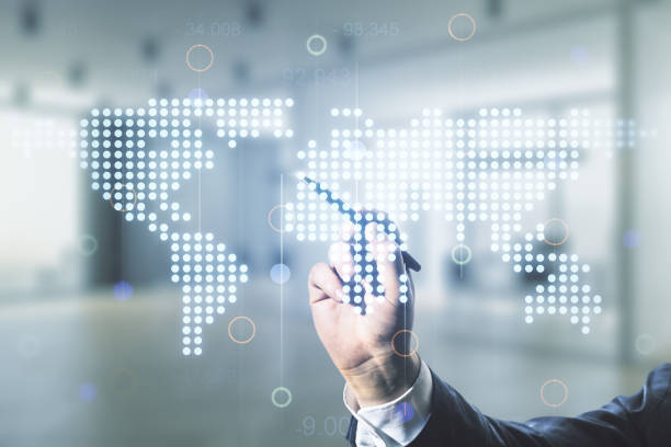 istock Man hand with pen working with abstract creative digital world map on blurred office background, globalization concept. Multiexposure 1297449479