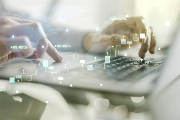 istock Multi exposure of abstract financial graph with world map and with hand typing on laptop on background, financial and trading concept 1297449510