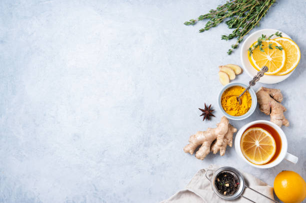 istock Creative flat lay with ingredients to boost immunity. Hot seasonal tea against viruses. Ingredients: ginger, thyme,  turmeric, anise and lemon. alternative medicine 1297449553