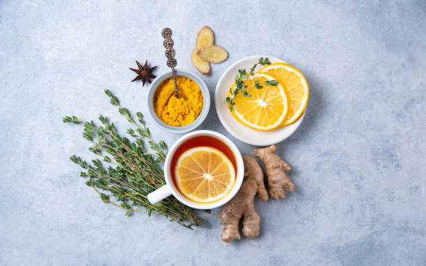 istock Creative flat lay with ingredients to boost immunity. Hot seasonal tea against viruses. Ingredients: ginger, thyme,  turmeric, anise and lemon. alternative medicine 1297449573