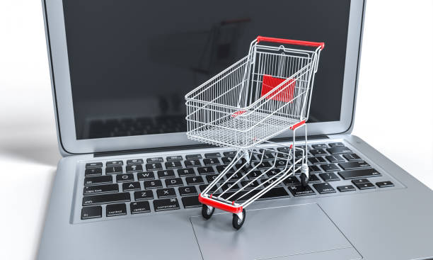 istock shopping cart on a notebook keyboard. online shopping and ecommerce 1297450335