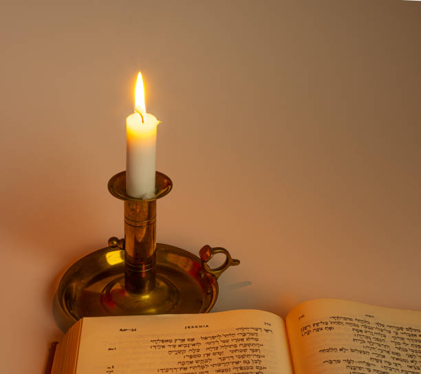 istock Book spread of a hebrew bible in soft light on a white background 1297450670