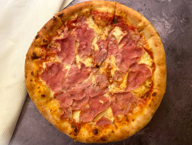 istock Ham and cheese pizza, also known as pizza cardinale with tomato sauce. 1297452297