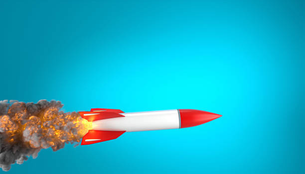 istock rocket with flames and smoke on a blue background. 1297454052