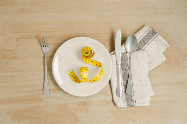 istock measuring tape on a plate with cutlery arranged on the table 1297454064