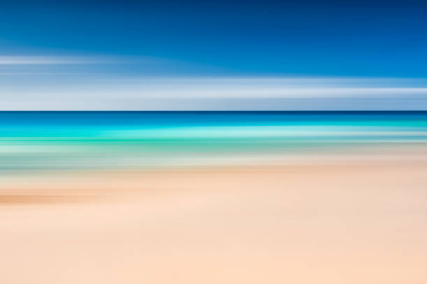istock A seascape abstract with panning motion combined with a long exposure.  Image displays soft, pastel colors in a retro style. 1297454098