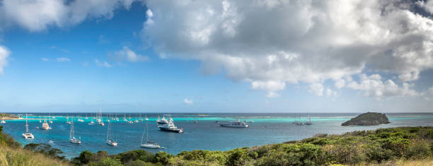 GRENADINES ISLANDS Panoramic view of Grenadines Islands with sailing boats tobago cays stock pictures, royalty-free photos & images
