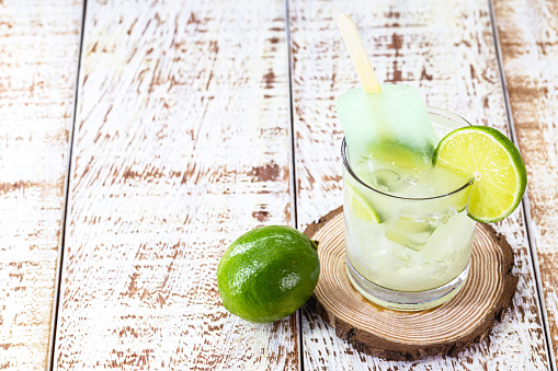 Brazilian lemon drink with distilled alcohol. Ice cream with drink called 