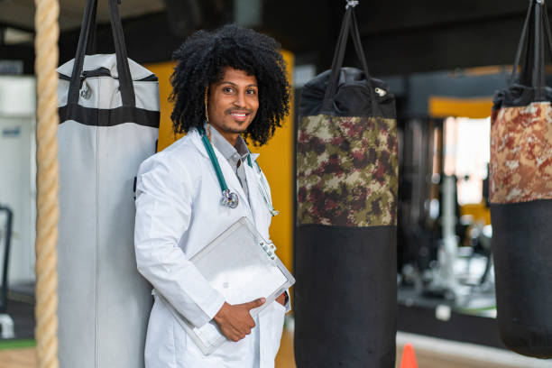 istock Young doctor standing in the gym 1297457355