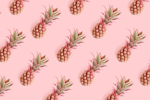 istock Trendy repetitive pattern made of pink pineapples. Summertime concept. 1297457592