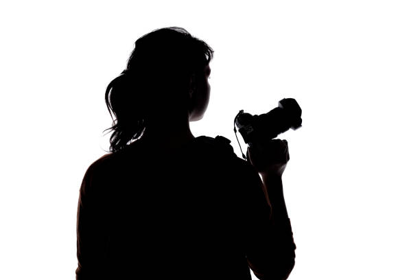 istock Silhouette of a Hiking Photographer 1297460246