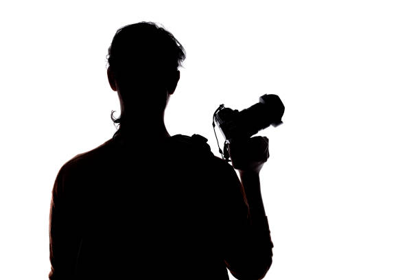 istock Silhouette of a Hiking Photographer 1297460247