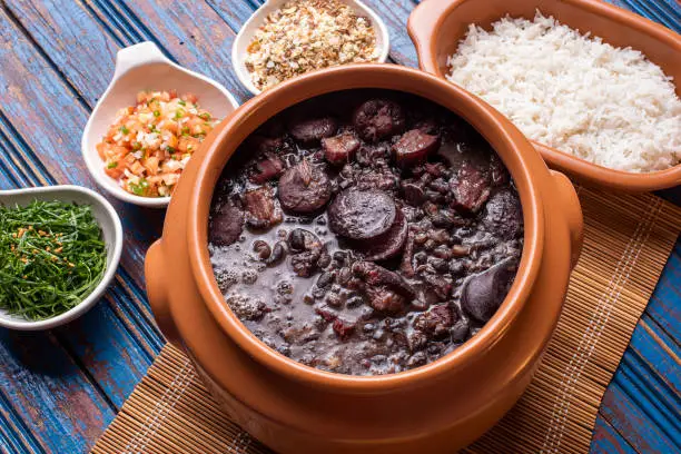 Feijoada, typical Brazilian food with black beans, pork and sausage.