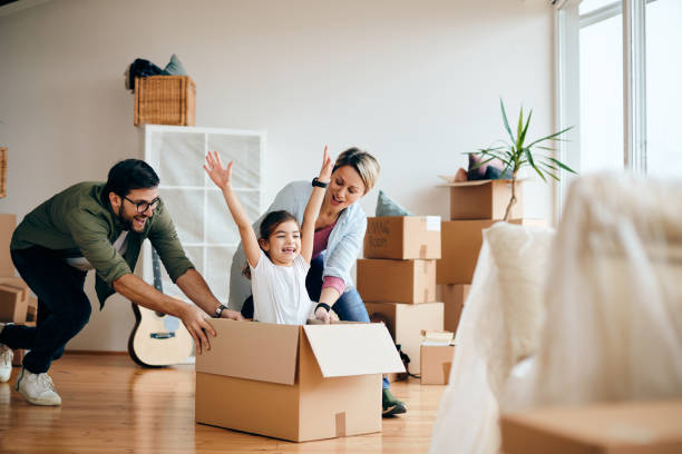 istock Carefree family having fun while moving into new home. 1297462173