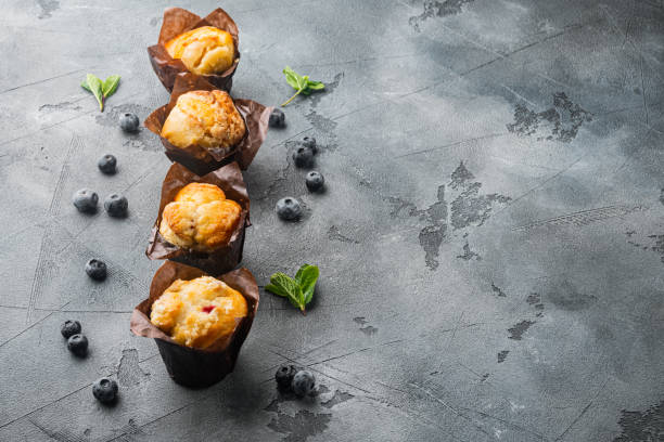 istock Blueberry muffins, on gray background with copy space for text 1297463359