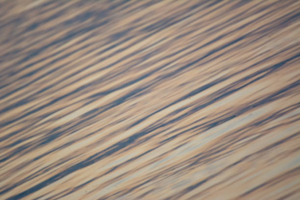 istock Lake surface pattern at sunset with blue and pink colors 1297463378