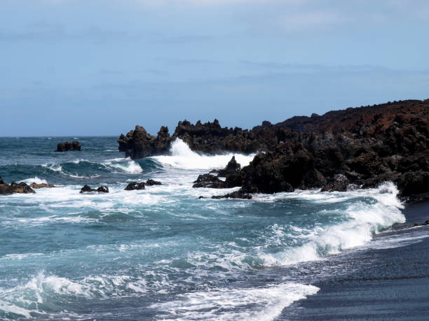 istock Typical black sand beach of volcanic origin 1297463390