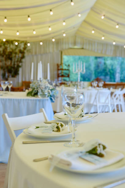 istock Table set with blank guest card, plate with white napkin and cutlery on table, copy space. Place setting at wedding reception. Table served for wedding banquet in restaurant 1297463465