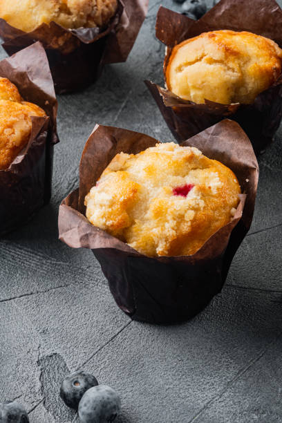 istock Blueberry muffins with fresh berries, on gray background 1297463762