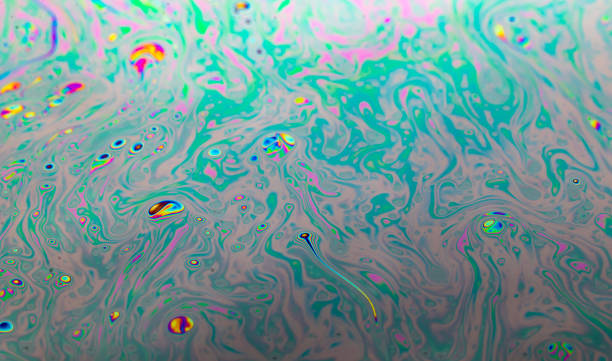 Background of abstract drawings of many colors in soapy water and bubbles Background of abstract drawings of many colors in soapy water and bubbles that resemble a sperm in the uterus searching for an egg water thinking bubble drop stock pictures, royalty-free photos & images