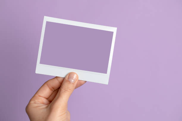 istock Hand Holding Instant Photo 1297464788