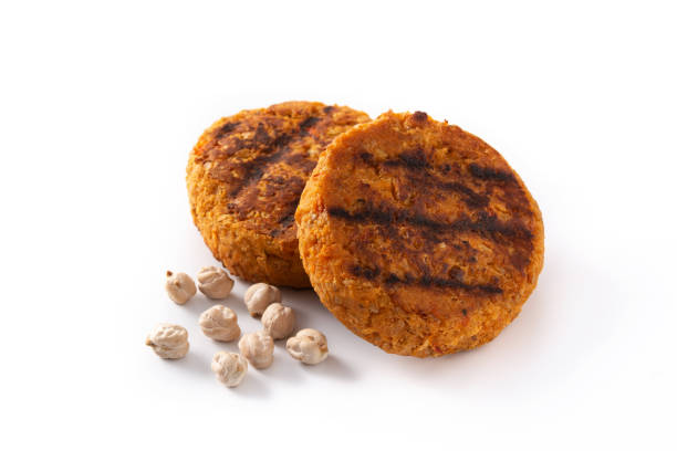 Delicious healthy chickpea burger Delicious healthy chickpea burger isolated on white background veggie burger photos stock pictures, royalty-free photos & images