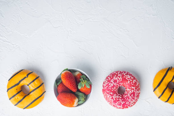 istock Glazed donuts, on white background, top view flat lay with copy space for text 1297473816