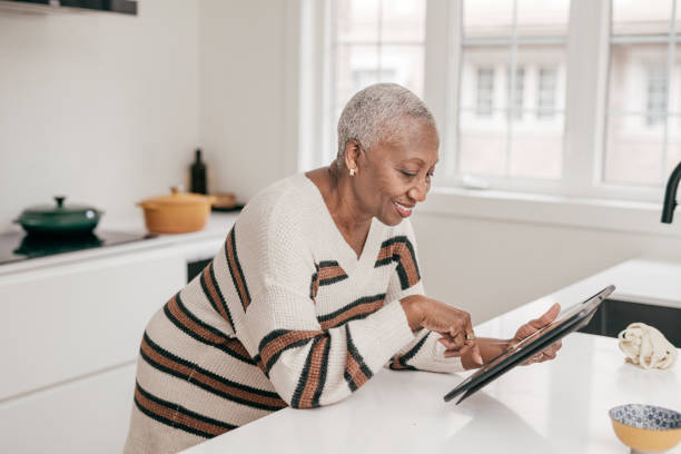 istock Senior women using online banking 1297473828