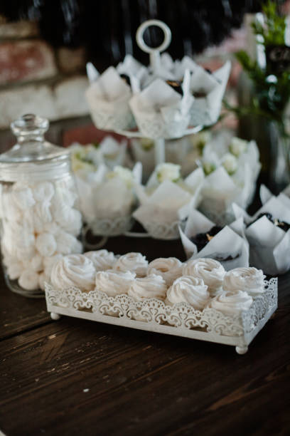 istock Candy bar. Festive table with deserts, strawberry tartlet and cupcakes. Reception Tartlets. Wedding. 1297474009
