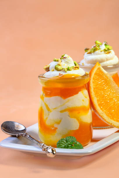 istock Cottage cheese and orange dessert. 1297474176