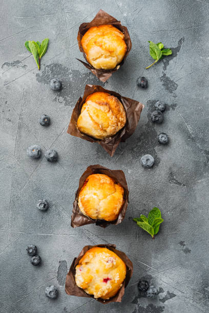istock Homemade blueberries muffins, on gray background, top view flat lay 1297474218