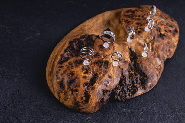 istock Beautiful piercing jewelry on wooden background. 1297475430