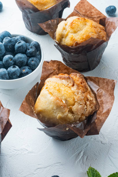 istock Homemade blueberries muffins, on white background 1297475592