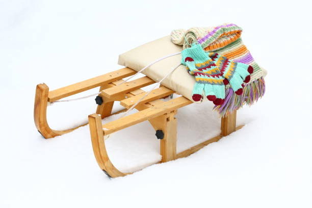 istock scarf and knit mittens on the sled 1297475598