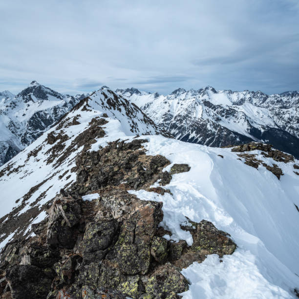 istock Aerial view of snowcapped mountains 1297476524