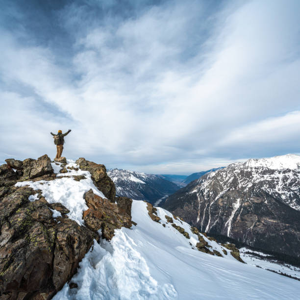 istock Happy men on top of the mountain 1297476671