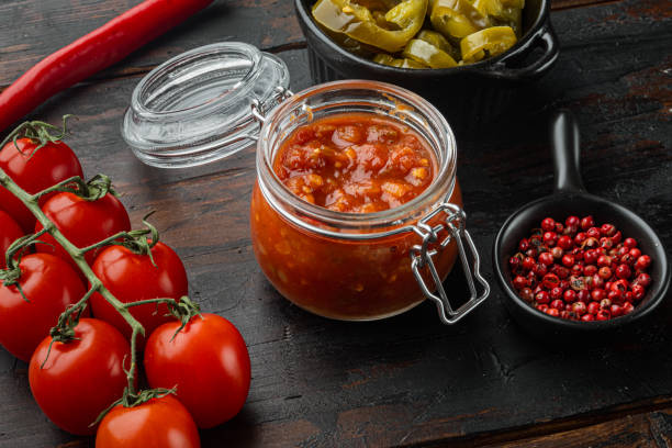 istock Mexican salsa sauce, on old dark  wooden table background 1297476805