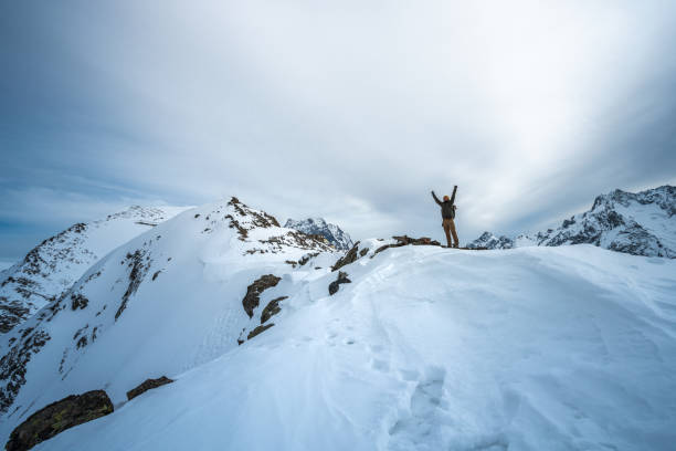 istock Happy men on top of the mountain 1297476971