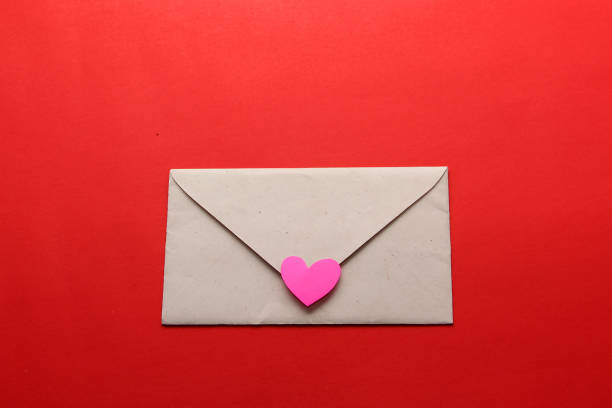 istock valentines love letters and messages with hearts on red background 1297476975