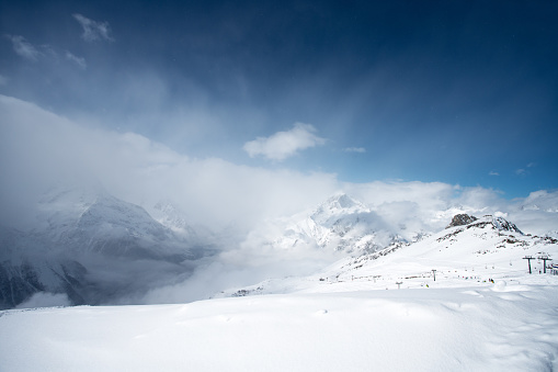 Snowcapped mountains. Ski resort.