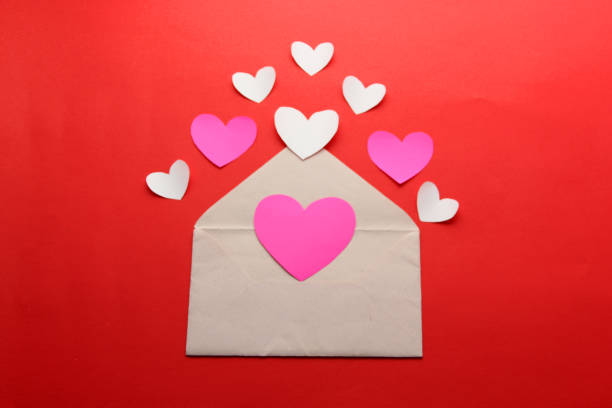istock valentines love letters and messages with hearts on red background 1297477038