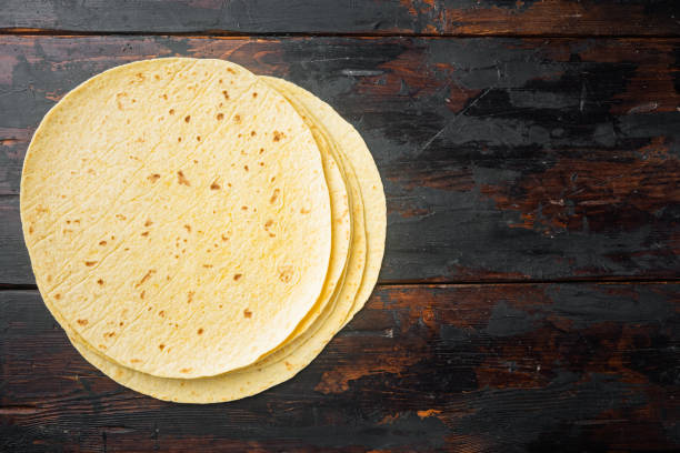 istock Mexican corn tortillas, on old dark  wooden table background, top view flat lay  with copy space for text 1297477116