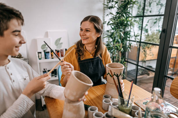istock Mother and son having fun in art studio 1297478113